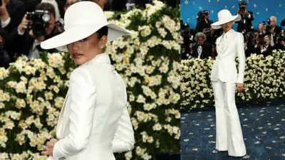 Zendaya shines at Met Gala 2025 in all-white suit, flaunts engagement ring.