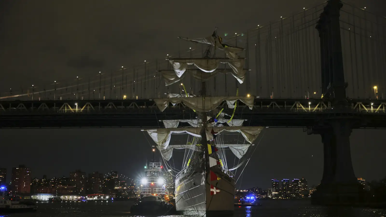 Mexican ship collision with Brooklyn Bridge leaves two dead, several injured.