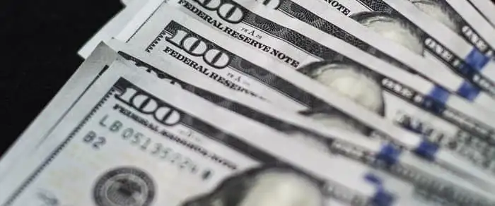 Falling oil prices threaten Big Oil's record shareholder payouts.