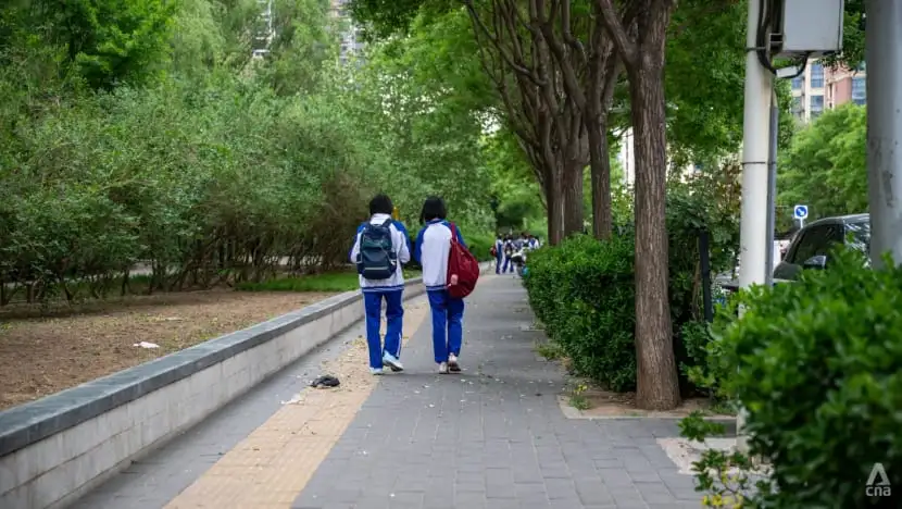 China enforces weekend breaks for high school students; mixed reactions.